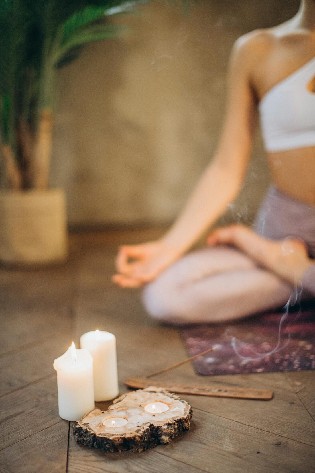 Candles, incense, and a still meditation seat — the contemplative space before a reading